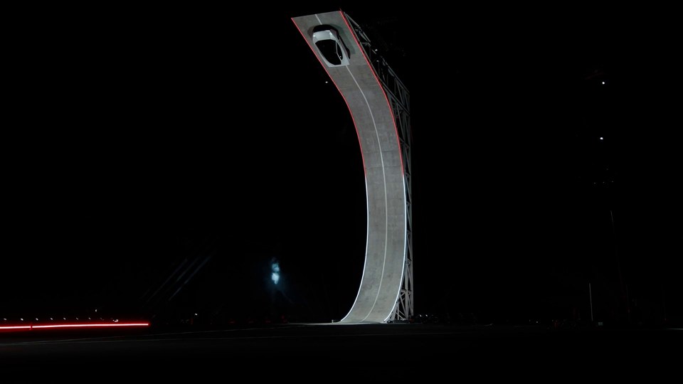 Source at 9 seconds: Roadster climbing the curved ramp